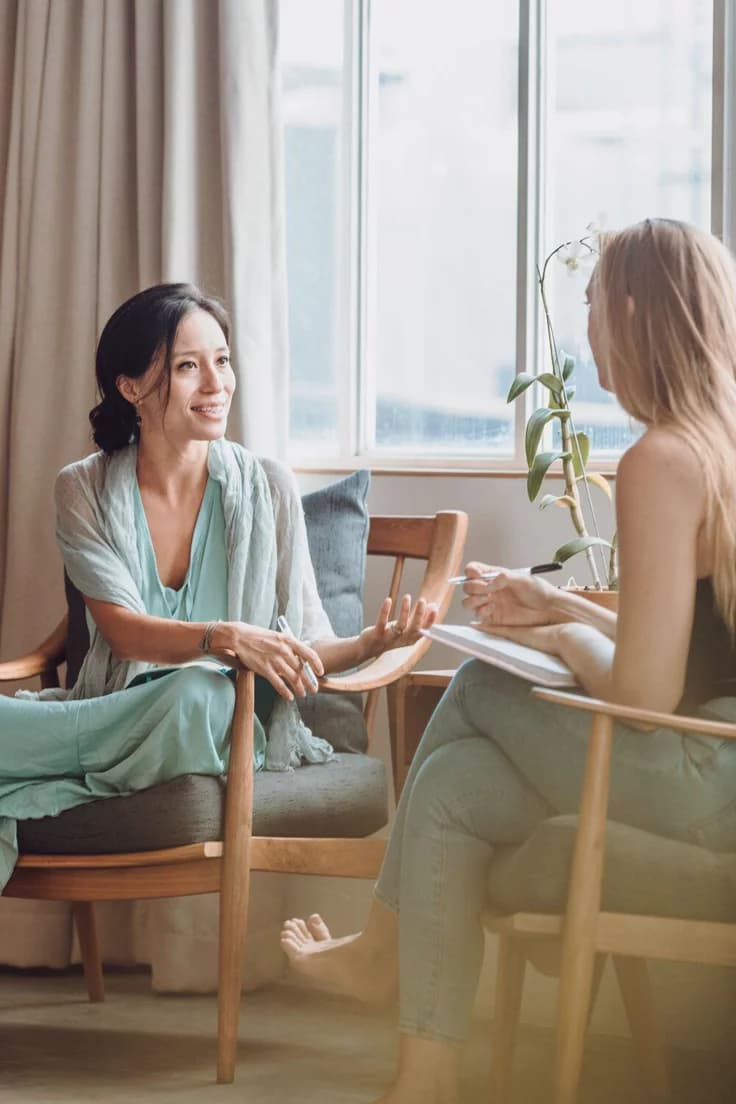 VitalCore coordinator in collaborative conversation with an allied health professional