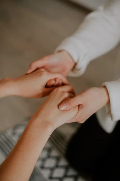 Practitioner and participant in a calm, relaxed setting focused on human connection